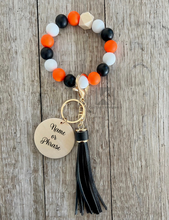 Load image into Gallery viewer, Orange Black and White Wristlet
